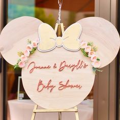 a wooden sign that says minnie and bridle's baby shower