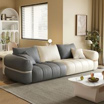 a living room filled with furniture and a white coffee table in front of a window