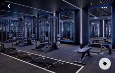 an empty gym with rows of exercise equipment