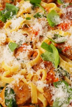 a close up of a plate of food with pasta and spinach