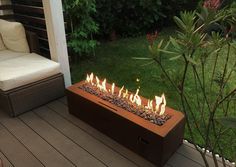 a fire pit sitting on top of a wooden deck