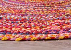 a multicolored rug is laying on the floor