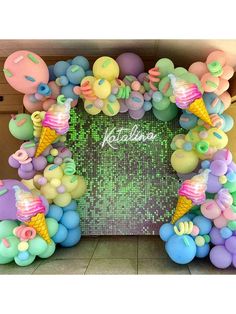 an ice cream themed birthday party with balloons and confetti on the front wall