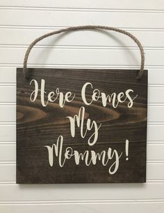 a wooden sign that says, here comes my mommy