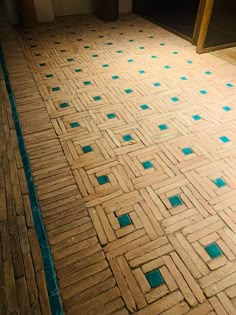 a bathroom floor with blue dots on it