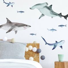 a bedroom with shark decals on the wall