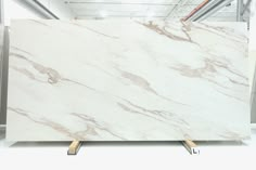 a large white marble slab in a warehouse