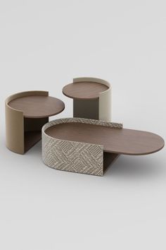 three tables with different shapes and sizes on each side, one is made out of cardboard