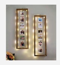 two mirrors with lights hanging on the wall next to each other and pictures in them