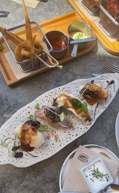 some food is laying out on a tray and ready to be eaten at the table