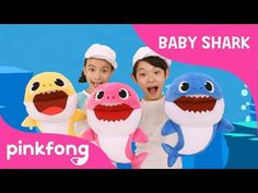 two children are holding stuffed animals in front of a pinkfong advertise