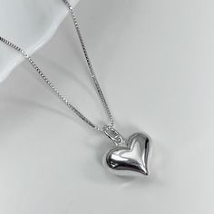 "High Polish Sterling Silver Puffed Heart Pendant on Sterling Silver Box Necklace Chain Please see second photo for size reference Necklace Size:  Please see sizing guide and select preference from drop down list Comes beautifully gift packaged, ready to gift. If you want the item gift packaged with a message card, please type your message in the \"add your personalization\" box or in the \"add a note to elleaccents\" box at the cart page. Shipping Policies: Please see FAQs below" Heart Necklace For Birthday And Valentine's Day, Cute Silver Charm Necklace For Valentine's Day, Heart Charm Necklace For Valentine's Birthday Gift, Heart-shaped Charm Necklace For Valentine's Day Birthday, Heart Pendant Charm Necklace For Birthday Gift, Silver Heart Charm Necklace For Birthday Gift, Silver Heart Charm Necklace For Birthday, Cute Heart Necklace For Valentine's Day, Dainty Silver Heart Necklace For Birthday Gift