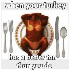 there is a plate with a bear on it and silverware next to the plate that says when your turkey has a better tan than you do