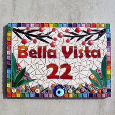 a mosaic tile sign with the words belja vista 22 and an eye on it