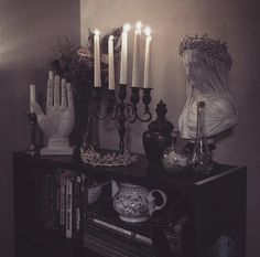 a shelf with candles and other items on it