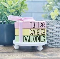 there is a cake that says tulips daisies daffodils