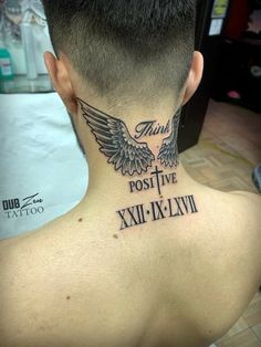 the back of a man's neck with an angel tattoo on it that reads, this post live xxii - xii