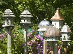 several bird houses are lined up next to each other