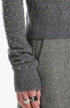 Domed studs create rich textural dimension for this woolly crewneck sweater that offers an ultracool, elevated take on a closet classic. Crewneck Long sleeves Ribbed cuffs and hem 70% wool, 30% polyamide Dry clean Imported Designer Clothing