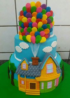 a birthday cake with balloons on top of it