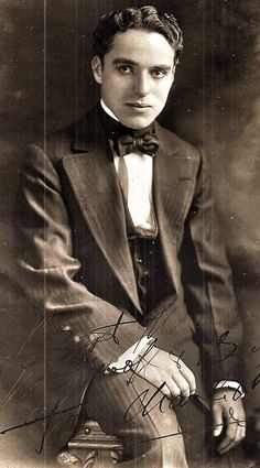 an old black and white photo of a man in a suit