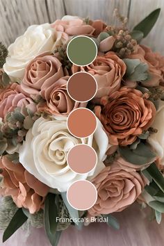 a bridal bouquet with roses and greenery in shades of peach, pink, green