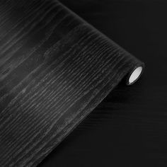 black wood grained paper on a table