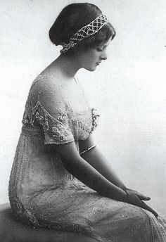 an old black and white photo of a woman