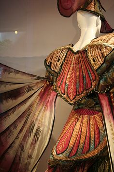 a mannequin dressed in an elaborately designed dress