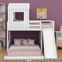 a white bunk bed sitting next to a purple wall