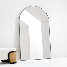 a mirror sitting on top of a white counter