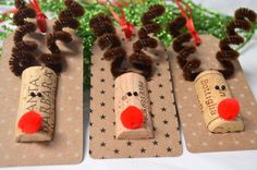 three wine corks with reindeer noses on them