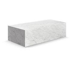 a white marble block sitting on top of a table