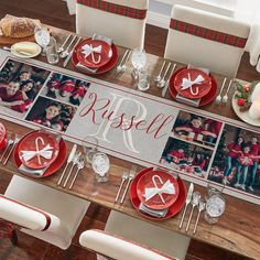 a christmas table setting with red and white plates, silverware and personalized placemats