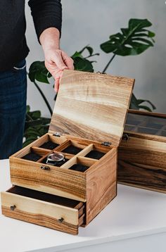 🕰️ Discover the perfect harmony of style and function with our exquisitely handcrafted Wooden Watch Boxes. Designed to keep your cherished timepieces organized and on display, these unique boxes are an essential addition to any watch enthusiast's collection.  Elevate Your Watch Collection with Our Handcrafted Wooden Watch Boxes! 🎨💼 Personalization at its Finest Choose elegance that resonates with you. Our watch boxes feature optional glass or wood lids, exuding sophistication. Add a personal touch with custom engravings, making them ideal gifts for occasions like Father's Day, birthdays, or anniversaries 🎁. 🛡️ Protection Meets Aesthetics Embrace the balance between protection and aesthetics. Each box comes with soft pillows that safeguard your watches from scratches and dust. The glas Luxury Jewelry Display, Wood Lids, Personalized Watch Box, Engraved Jewelry Box, Wood Watch Box, Wooden Watch Box, Personalized Watch, Watch Organizer, Personalized Watches