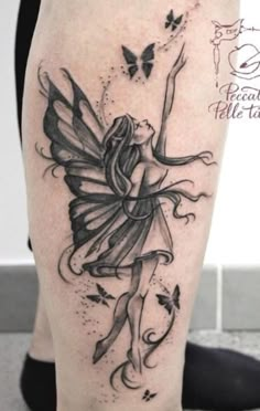 a woman with a tattoo on her leg and a butterfly flying above her legs,