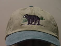 NEW EMBROIDERED BLACK BEAR WILDLIFE BASEBALL HAT (HATS SHOWN ARE KHAKI/FOREST GREEN, KHAKI/NAVY BLUE, KHAKI/ROYAL BLUE AND KHAKI/BLACK) Adams Optimum 6 Panel Two Tone Color Baseball Hat Low Profile - 100% Cotton Twill Adult Cap Pigment Dyed - Garment Washed Hat 6 Panels with Sewn Matching Eyelet Visor with 3 Rows of Stitching Pre-formed Bill - Leather Strap with Brass Grommet Adjustable - One Size Fits Most An Extremely Comfortable Baseball Hat! Enjoy the Embroidered Black Bear Wildlife Hat! We Cheap Embroidered Snapback Hat, Cheap Embroidered Snapback Hat For Streetwear, Cheap Embroidered Snapback Fitted Hat, Cheap Vintage Dad Hat, Will And Bear Hats Women, Cheap Embroidered Men's Baseball Cap, Affordable Embroidered Casual Dad Hat, Vintage Men's Dad Hat, Cheap Cute Unisex Hats