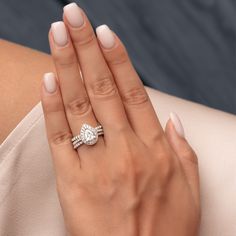 a woman's hand with a ring on it