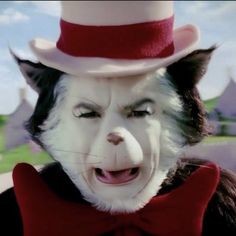 the cat in the hat is wearing a red bow tie and white suit with his mouth open