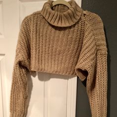 a sweater hanging up on a door hanger