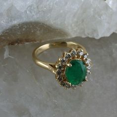 Vintage 14K Yellow Gold Oval Emerald and Diamond Halo Ring, 1.53ct emerald set high 5/16 inches on ring, basket setting, oval emerald 1.53 ct, 9x7mm, .56 ct round diamonds halo (16 total), .5 inches across, Ring size 4.75, Circa 1960, 4 grams. Stock # BB256R04 Most rings are sizable for a small fee. If the ring you are considering is the incorrect size contact us for a quote. This listing contains photographs of the actual item you will receive. Our items are in excellent condition with little o Oval Gold Emerald Ring With Halo Setting, Formal Green Oval Cluster Ring, Formal Oval Green Cluster Ring, Oval Emerald Ring In Yellow Gold With Halo Setting, Heirloom Oval Emerald Cluster Ring, Gold Oval Emerald Ring With Prong Setting, Vintage Oval Emerald Ring With Halo Setting, Green Oval Cluster Ring With Hallmark, Oval Green Cluster Ring In 14k Gold