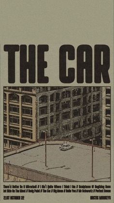 an advertisement for the car, featuring a parking lot in front of some tall buildings