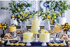 a table topped with lots of cakes and desserts