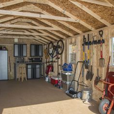 a garage filled with lots of tools and other things on the wall next to it