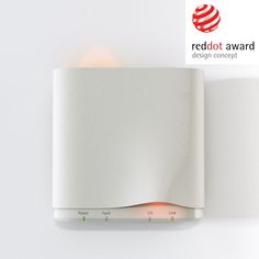 the red dot award is displayed on a white wall