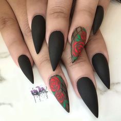 black stiled nails with red roses on the tip and green leaves on the tips