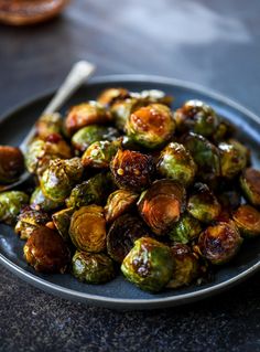 brussel sprouts on a plate with a spoon