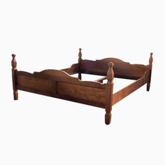 an old wooden bed frame with no headboard and foot board on the bottom side