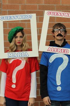 two people wearing costumes with question marks on them