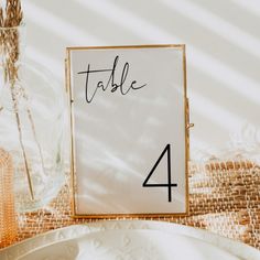 a table number is placed on top of a plate